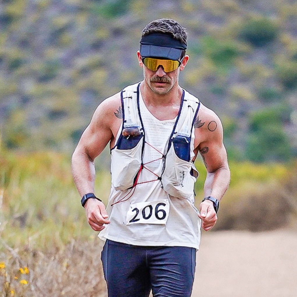 Jonathan Hanson running on a trail